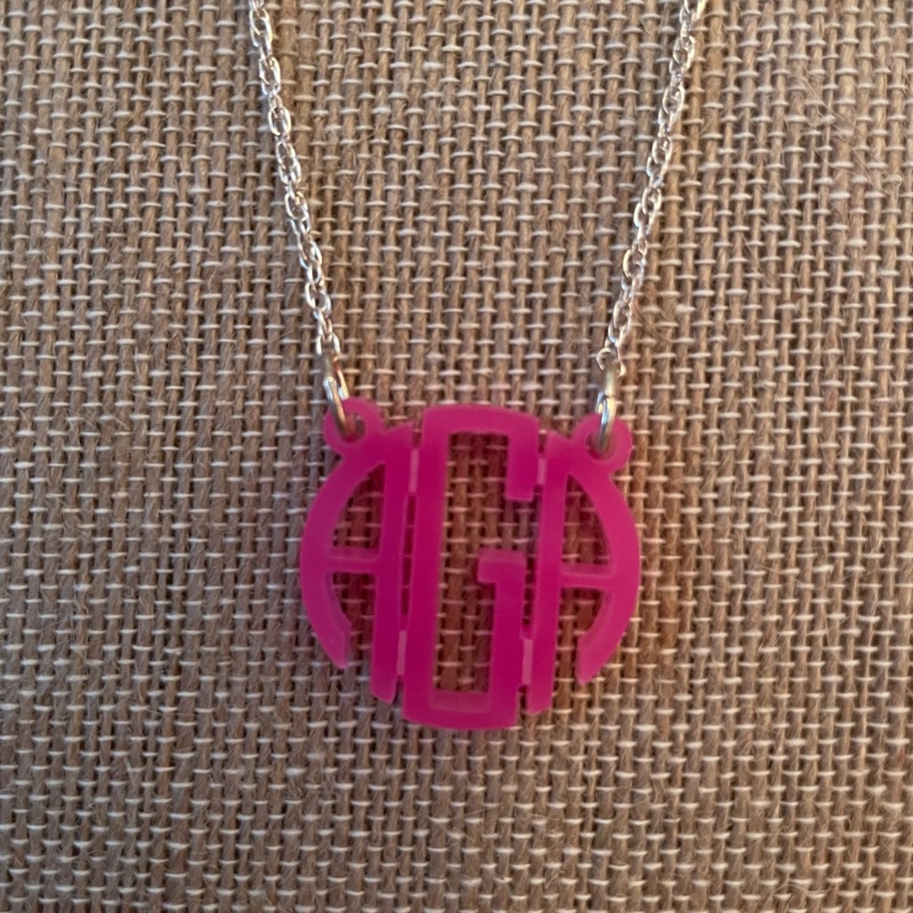 Sterling silver monogram acrylic necklace. Initials are AAG. 20” long chain.